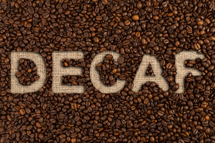 Decaf coffee beans symbolizing Swiss Water and sugarcane decaffeination methods